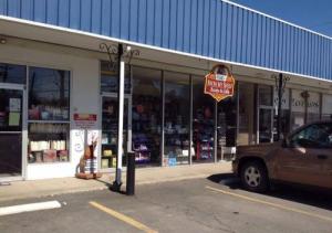 storefront_with_hobo_and_sign_hanging_0